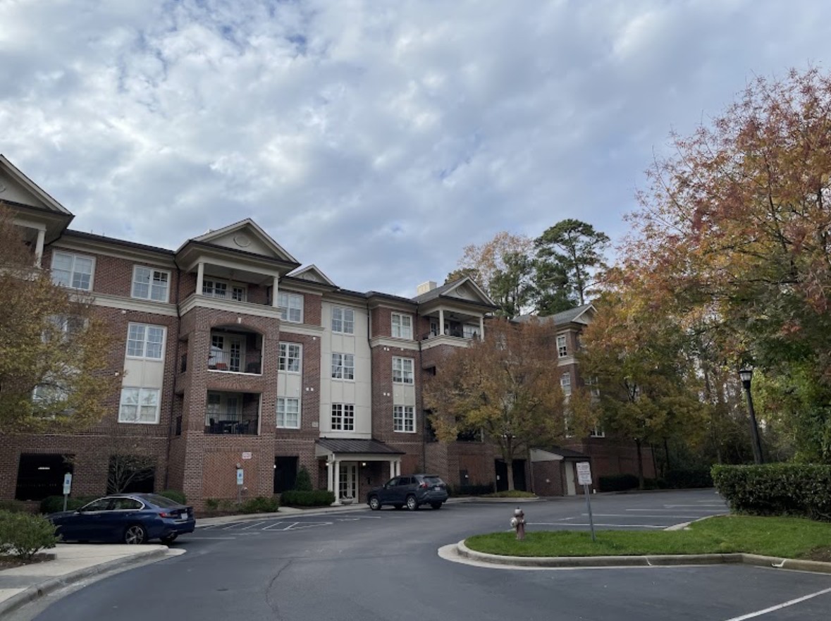 Brick condominium building in Raleigh serviced by Omni Home