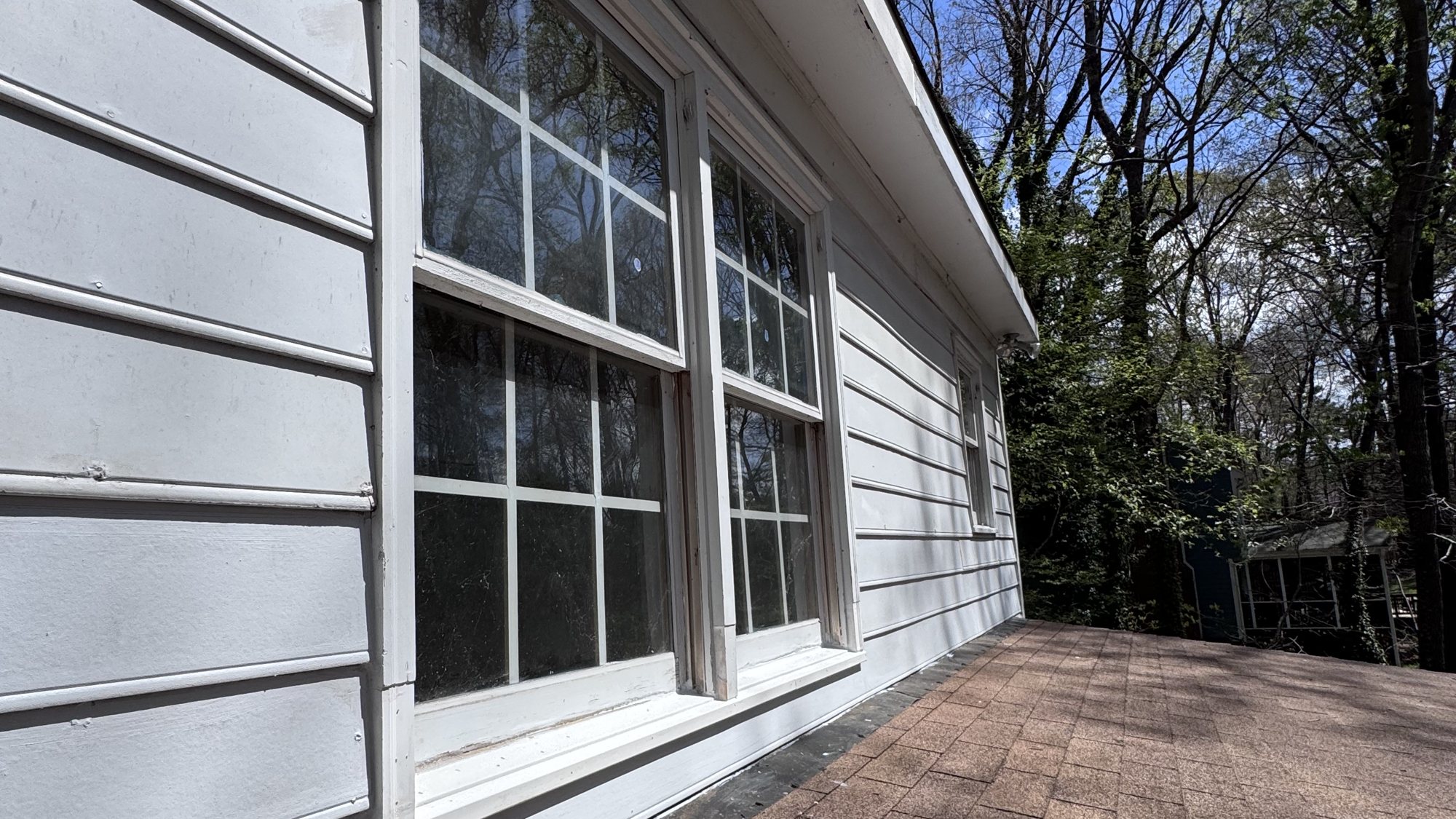 Exterior siding and window trim on a home serviced by Omni Home