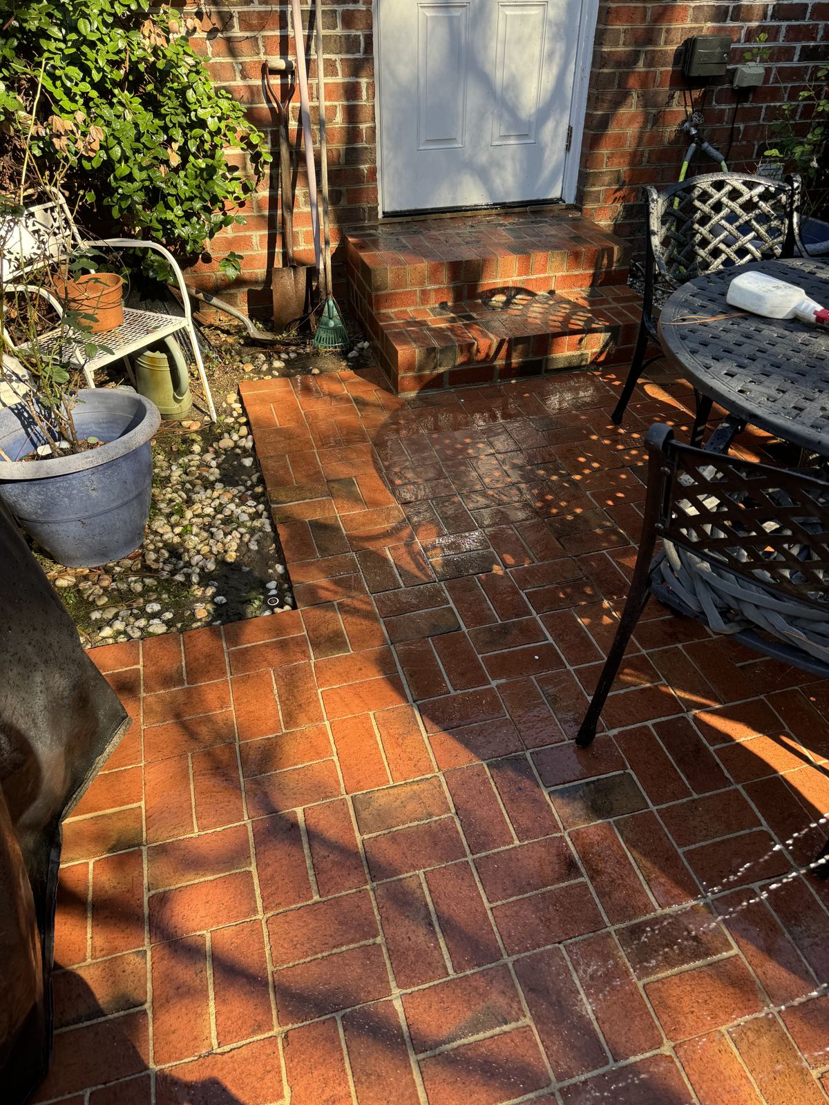 Brick patio after pressure washing by Omni Home