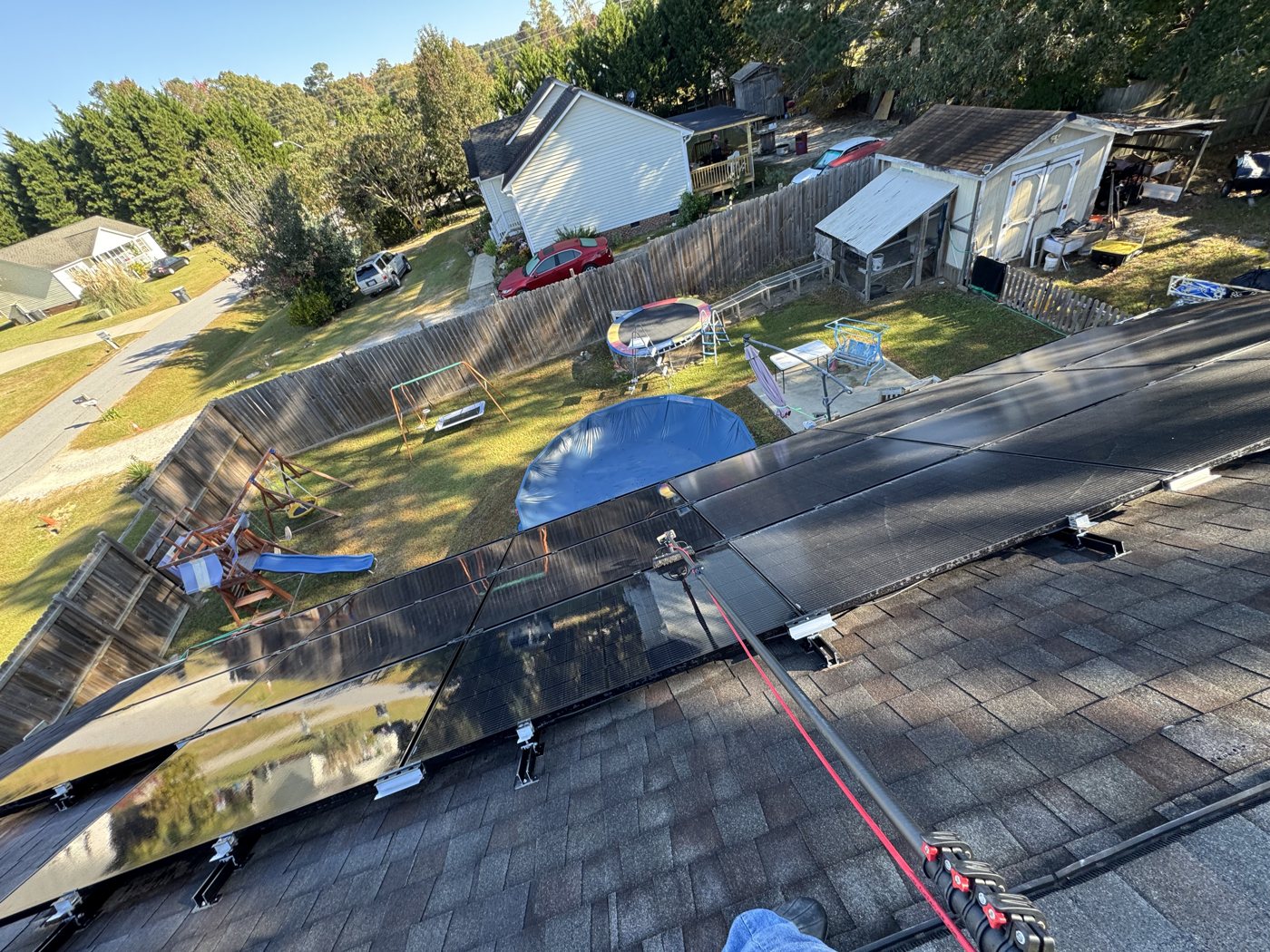 Rooftop solar panels on a home serviced by Omni Home Property Care